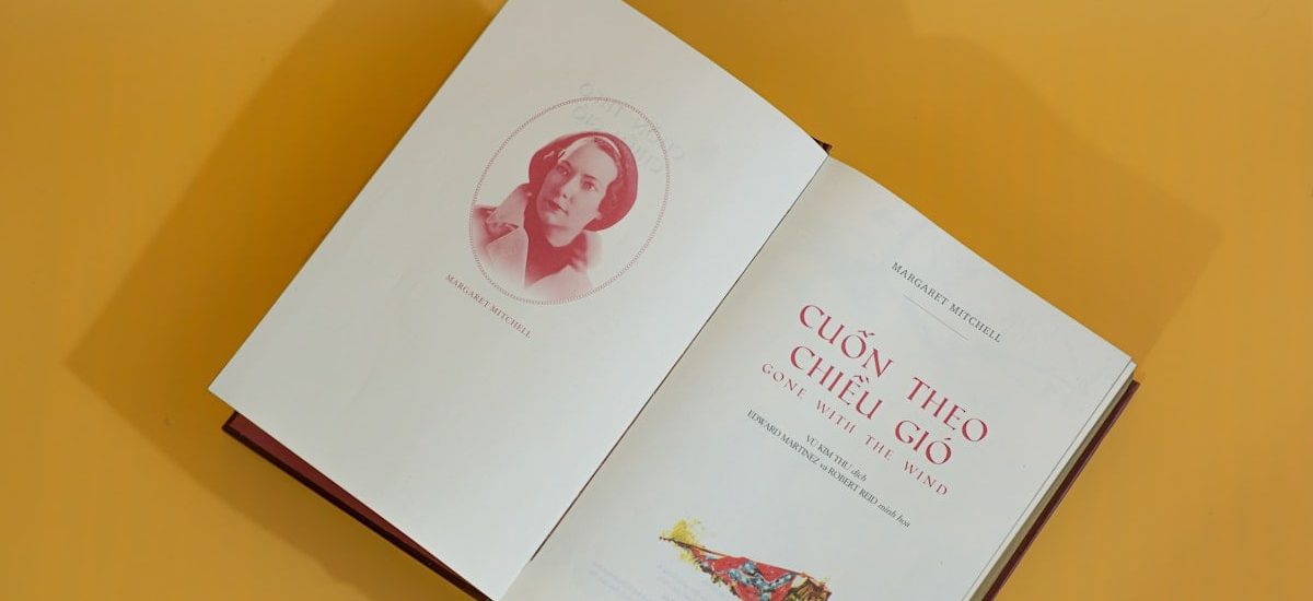 an open book with a picture of a woman