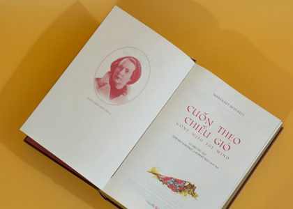 an open book with a picture of a woman